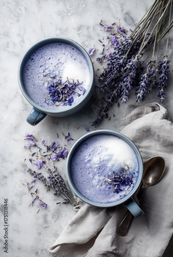 Lavender Drinks With Frothy Milk and Dried Flowers on a Marble Surface Near a...