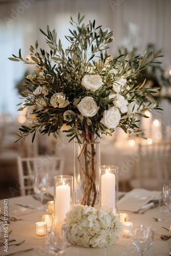 Elegant Floral Arrangement With White Roses and Olive Branches at Wedding Rec...