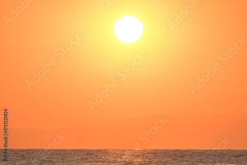 Golden sunrise over the sea in Paralia, Katerini, Greece.