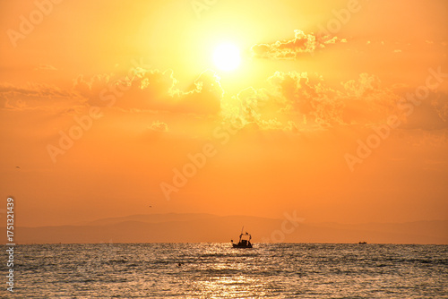 Golden sunrise over the sea in Paralia, Katerini, Greece.