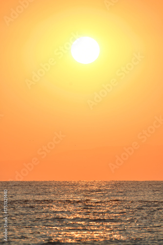 Golden sunrise over the sea in Paralia, Katerini, Greece.