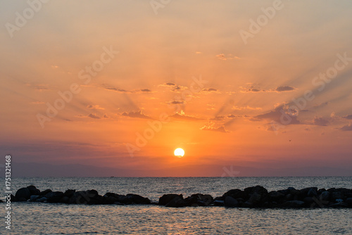 Golden sunrise over the sea in Paralia, Katerini, Greece.