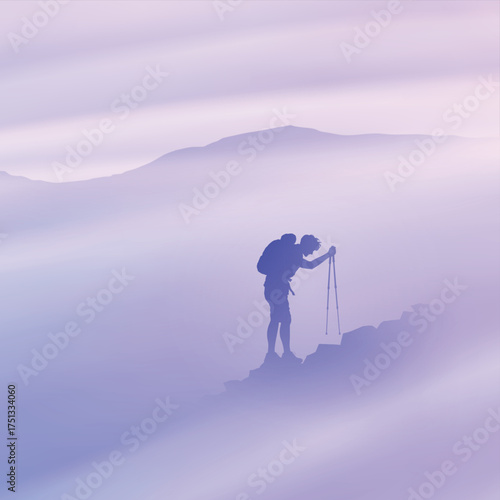 Man on rocky mountain. Climbing with trekking poles. Silhouette in fog