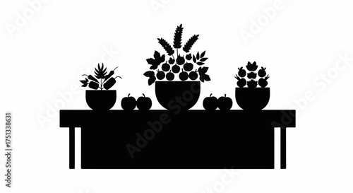 Silhouette of a bountiful harvest display featuring fruits and plants on a table, evoking abundance and nature's richness.