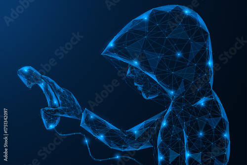 A digital fraudster. A hooded man is holding a telephone receiver. The concept of secrecy, deception, and security threats in the digital world.