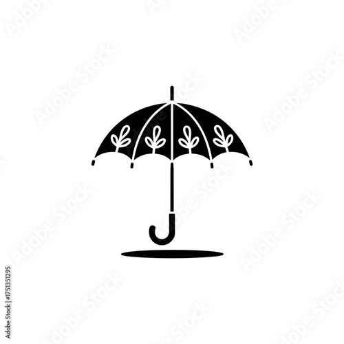 Decorative umbrella icon design with leaf patterns in black silhouette style on white background