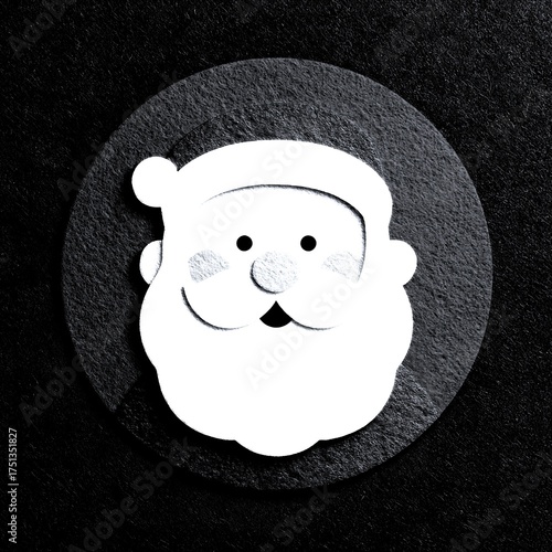 Festive Santa Claus decoration made from paper on a background during holiday season
