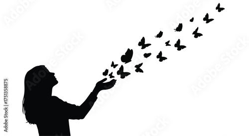 Silhouette of a woman releasing a swarm of butterflies into the sky, symbolizing freedom and new beginnings.