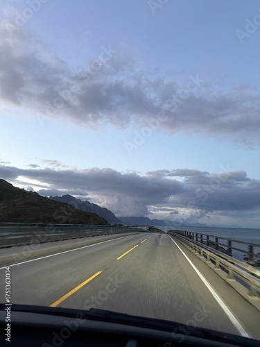 driving on the highway along the coast in the evening
