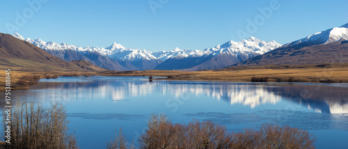 Lake Clearwater surrounded by snow capped mountain peaks of Southern Alps