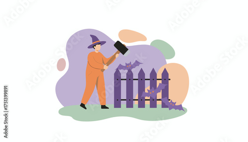 Person in witch hat decorating a spooky fence with bats for Halloween celebration