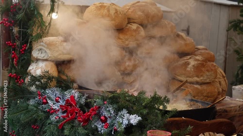 Cinematic view of a cozy Christmas market food court. People enjoy hot meals and winter drinks in a festive, family atmosphere with smoke rising from food stalls.