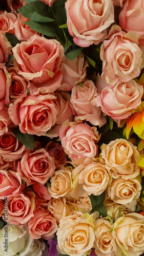 roses,designer composition of artificial flowers, floral background in retro style