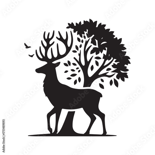 Deer silhouette standing behind a tree