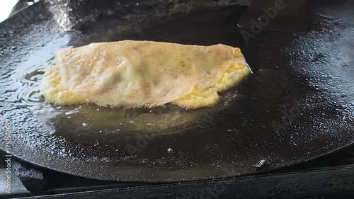egg martabak on the frying pan