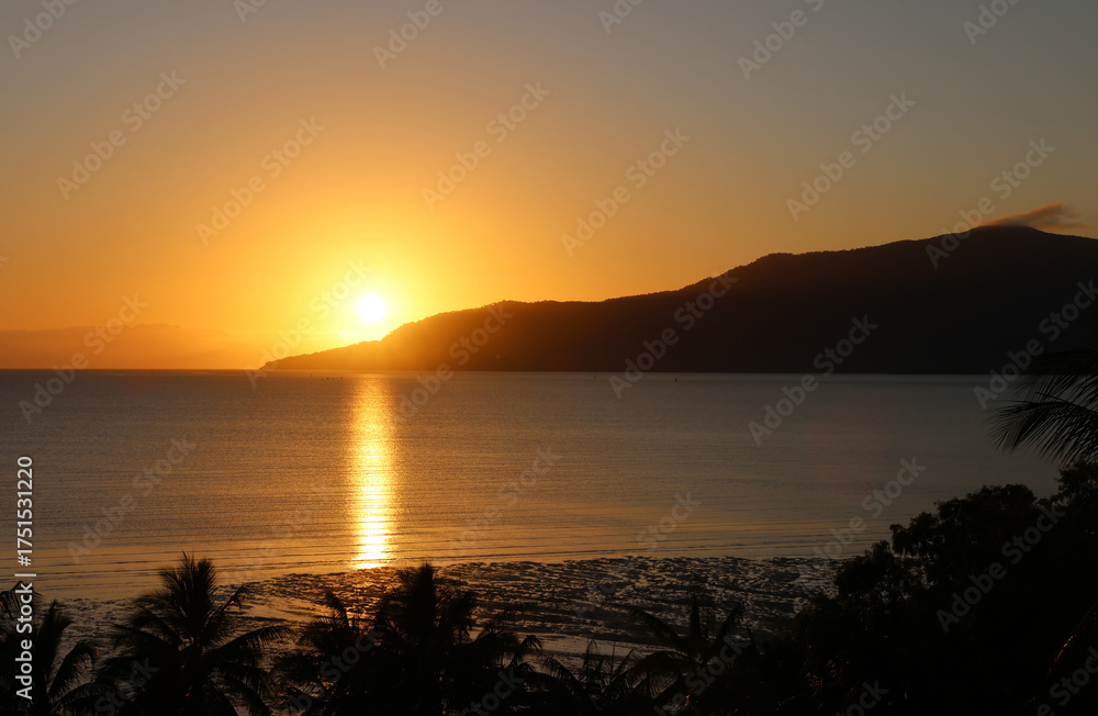 Fototapeta premium Peaceful sunrise over the ocean at the Cairns Esplanade in Queensland, Australia