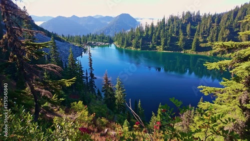 A breathtaking view of the vibrant blue waters of Lake Valhalla, nestled amidst the stunning wilderness of Washington and part of the iconic Pacific Crest Trail