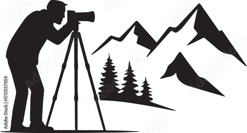 Silhouette photographer with camera on tripod against mountain landscape