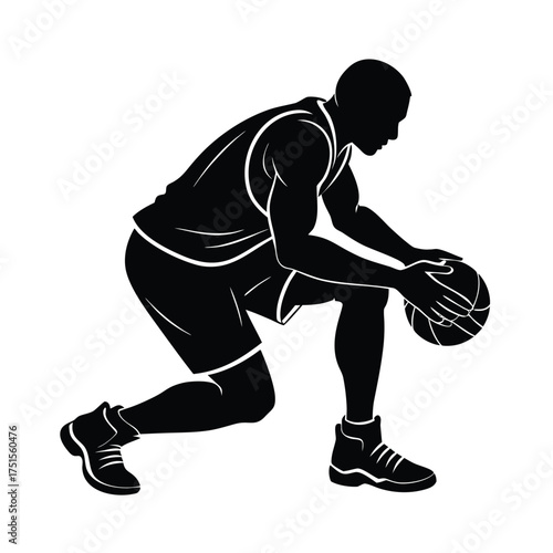 Silhouette of a basketball player dribbling low to the ground