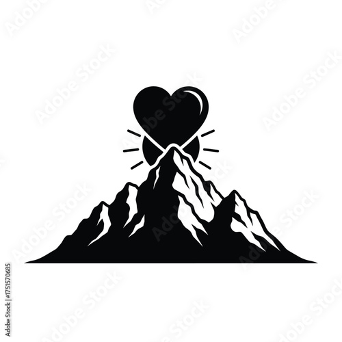 Black heart on mountain peak with sun rays love