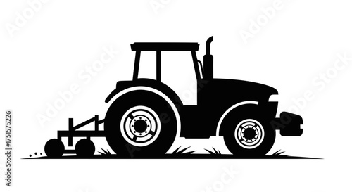 Bold and utilitarian silhouette of a modern farming tractor in action, working in an agricultural field
