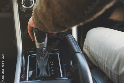 the hand man driving and controlling the automatic car