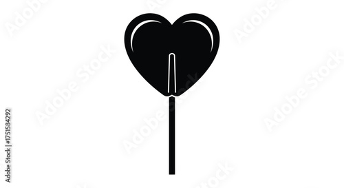 Black heart shaped lollipop on white background candy