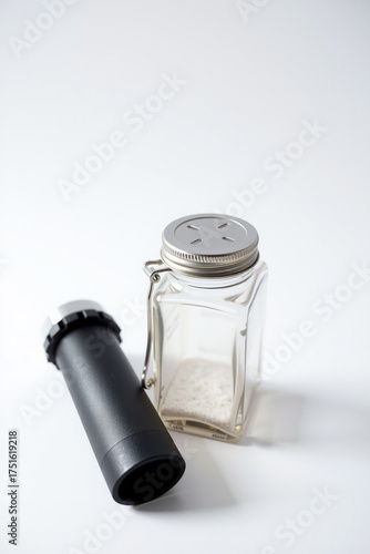 A Salt Shaker On A White Background