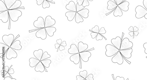 A delicate and whimsical pattern of scattered four-leaf clovers on a white background.