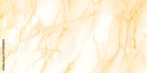 Luxurious marble texture with warm beige, cream, and golden tones. The pattern features smooth, flowing veins of gold and amber running through a soft ivory background.