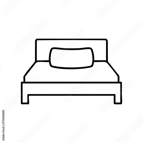 A simple bed with a pillow