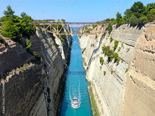 Photo of boats navigating through the narrow Corinth Canal in Greece.