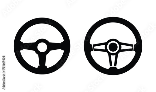 Two black steering wheels facing forward isolated on white background