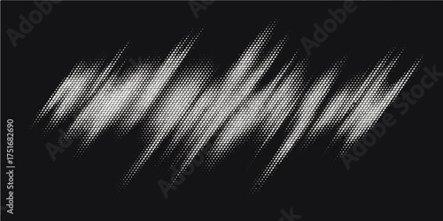 A dark, elegant feather in motion against a black background with a hint of light and smoke