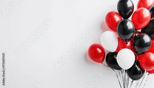 Colorful balloons in red, black, and white arranged together create festive atmosphere, perfect for celebrations and events. vibrant colors add joy and excitement to any occasion
