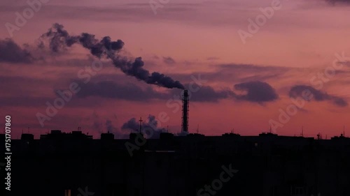 Wallpaper Mural Tall industrial chimney releasing thick black smoke against a dramatic red sky. Concept of harmful factory emissions, air pollution, and environmental impact Torontodigital.ca