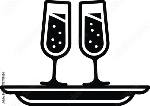 Two flutes of champagne sit on a tray, ready for a celebration.