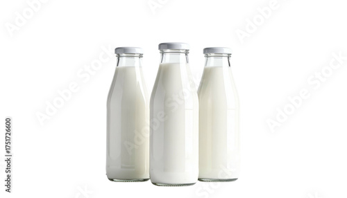Three old-fashioned glass milk bottles, filled with white liquid, against a black background