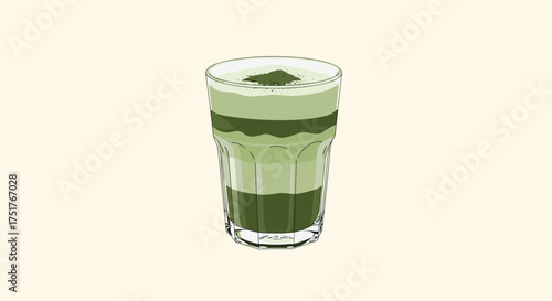 A tall glass with layers of green beverage is displayed on a light background.