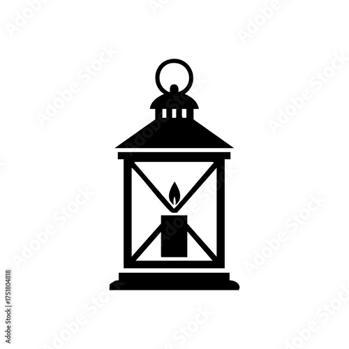Classic lantern with a burning candle inside, evoking warmth, light, and cozy seasonal ambiance for home or outdoor decor.
