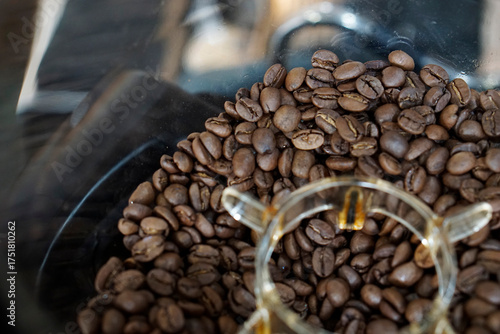 Top view of coffee bean in grinder hopper.      