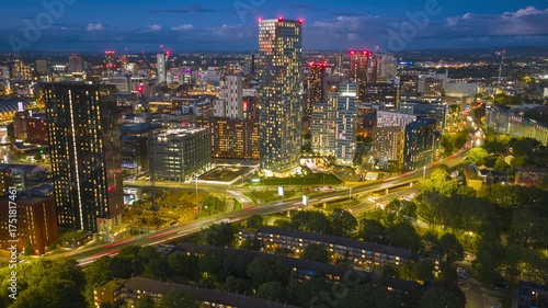 Aerial hyperlapse gliding over Mancunian Way, revealing Manchester’s skyline and modern towers glowing at blue hour.