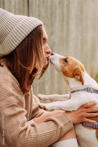 A girl kisses a dog 7277.