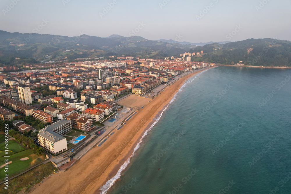 Obraz premium Drone view of Zarautz town and the beach on summer morning. Basque Country, Spain.