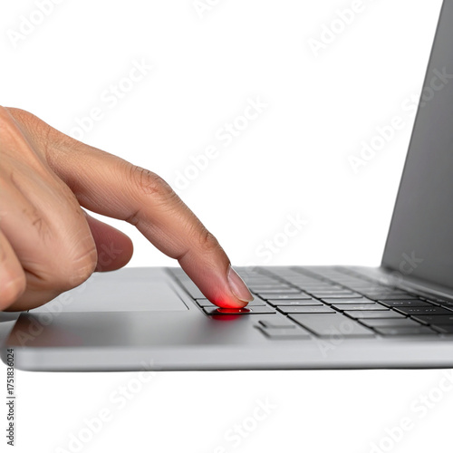 Human finger pressing a glowing red key on a laptop keyboard.