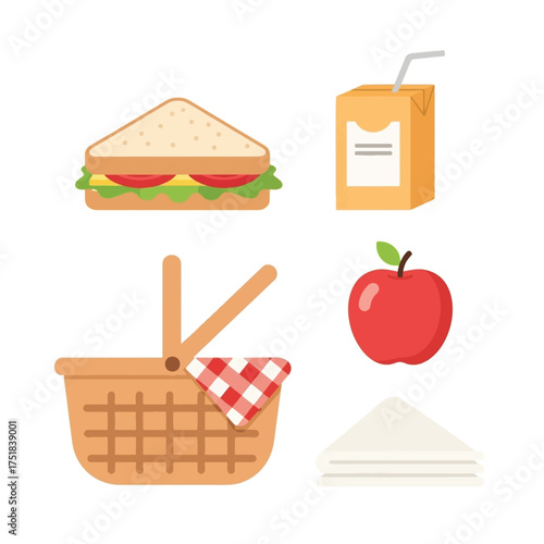 A delightful picnic spread featuring a sandwich, juice box, apple, basket, and napkins, perfect for an outdoor meal.