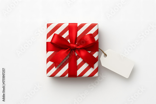 Gift box with red and white diagonal stripes and blank tag