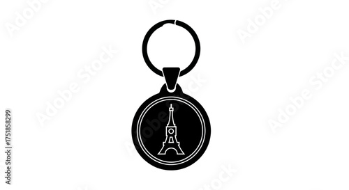 Black and white silhouette of a circular Eiffel Tower keychain.