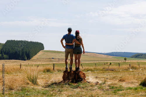 A couple on vacation admiring the landscape of Auvergne, France
