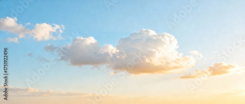 Soft clouds floating in a bright blue sky at sunset  